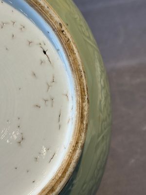 A Chinese monochrome celadon-glazed jar with anhua chilong and floral design, Kangxi — photo 14
