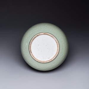 A Chinese monochrome celadon-glazed jar with anhua chilong and floral design, Kangxi — photo 6