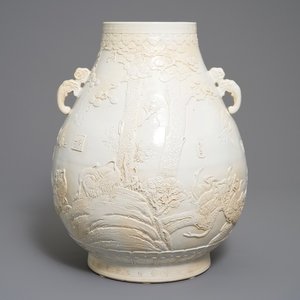 A Chinese monochrome cream-glazed relief-decorated hu vase, Qianlong mark, 20th C. — 照片 1