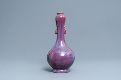 A Chinese monochrome flambé-glazed garlic head vase, 19th C.