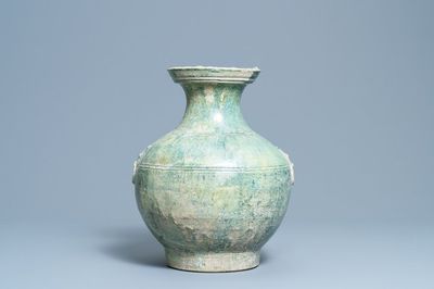 A Chinese monochrome green-glazed jug, Han