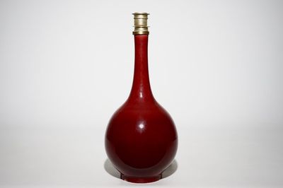 A Chinese monochrome red bottle vase mounted as a lamp, 19th C.