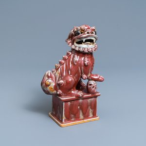 A Chinese monochrome sang de boeuf model of a Buddhist lion, 19th C. — 照片 1