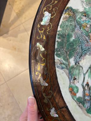 A Chinese mother-of-pearl-inlaid hongmu table with a circular Canton famille verte 'warriors on horseback' plaque, 19th C. — photo 11