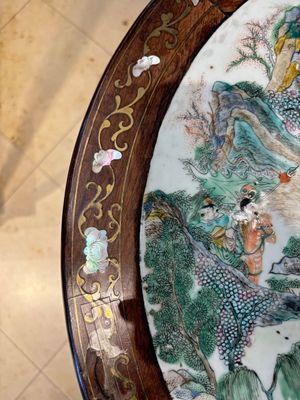 A Chinese mother-of-pearl-inlaid hongmu table with a circular Canton famille verte 'warriors on horseback' plaque, 19th C. — photo 12