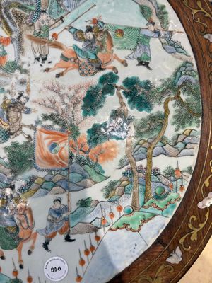 A Chinese mother-of-pearl-inlaid hongmu table with a circular Canton famille verte 'warriors on horseback' plaque, 19th C. — photo 7