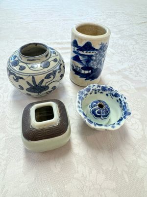 A Chinese Nanking water pot, a blue and white brush pot, a jarlet and a trick cup, Ming and later — photo 1