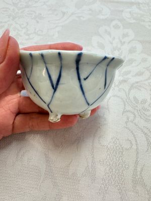 A Chinese Nanking water pot, a blue and white brush pot, a jarlet and a trick cup, Ming and later — photo 27
