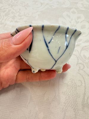 A Chinese Nanking water pot, a blue and white brush pot, a jarlet and a trick cup, Ming and later — photo 28