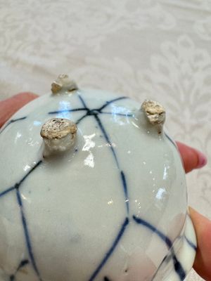 A Chinese Nanking water pot, a blue and white brush pot, a jarlet and a trick cup, Ming and later — photo 35