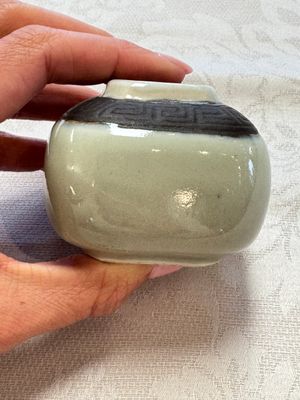 A Chinese Nanking water pot, a blue and white brush pot, a jarlet and a trick cup, Ming and later — photo 37