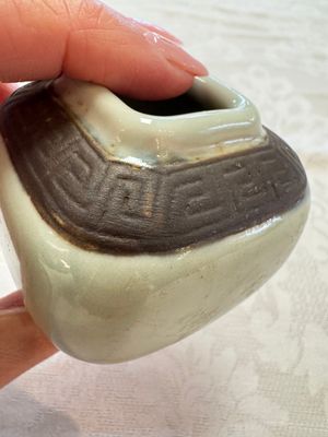 A Chinese Nanking water pot, a blue and white brush pot, a jarlet and a trick cup, Ming and later — photo 40