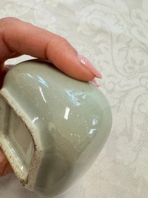 A Chinese Nanking water pot, a blue and white brush pot, a jarlet and a trick cup, Ming and later — photo 51
