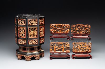 A Chinese octagonal gilt-lacquered wooden stand and four wooden carvings on stands, 19th C.