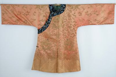 A Chinese orange ground silk embroidered dragon robe, 19th C.