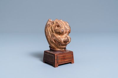 A Chinese painted pottery model of a mythical beast's head, Tang