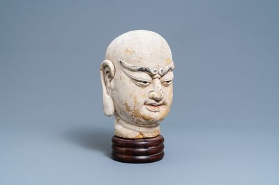 A Chinese painted sandstone head of a luohan, Ming