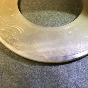A Chinese pale celadon jade bi disc, Ming or earlier — photo 11