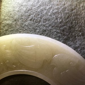 A Chinese pale celadon jade bi disc, Ming or earlier — photo 18