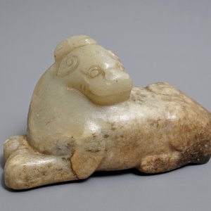 A Chinese pale greenish-grey and brown jade model of a mythical beast, Qing — photo 1