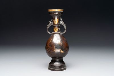 A Chinese parcel-gilt bronze vase with dragon-form handles, Yuan/Ming