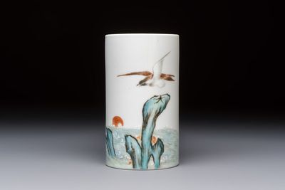 A Chinese polychrome brush pot with a bird standing on rockwork amid waves, Qianlong mark, 20th C.