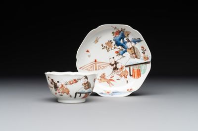 A Chinese polychrome cup and saucer with figures and a dog, Yongzheng