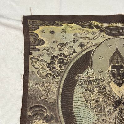 A Chinese polychrome-decorated brocade 'Padmasambhava' thangka — foto 17