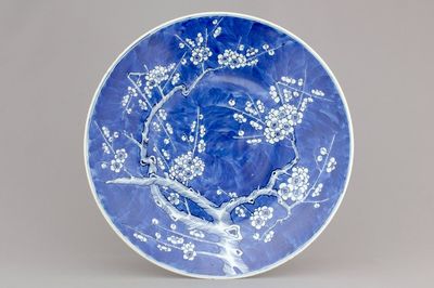 A Chinese porcelain dish with prunus blossoms, 19th C