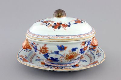 A Chinese porcelain imari tureen and cover on stand, decorated with fish, 18th C.