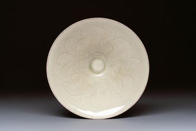 A Chinese qingbai tea bowl with incised floral design, 20th C.