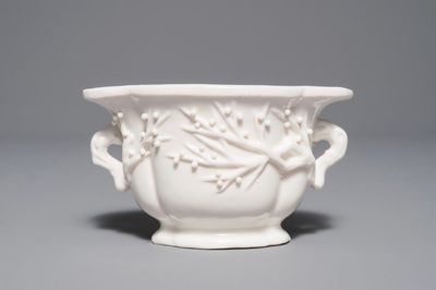 A Chinese quatrefoil blanc de Chine two-handled wine cup, Kangxi