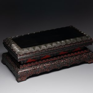 A Chinese rectangular carved red and black lacquer stand, 20th C. — photo 1