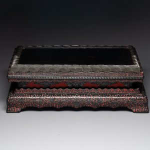 A Chinese rectangular carved red and black lacquer stand, 20th C. — photo 2