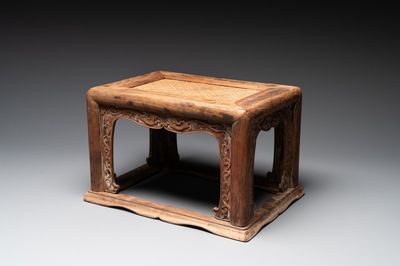 A Chinese rectangular huanghuali wooden stool with 'chilong' design, 17/18th C.