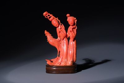 A Chinese red coral group of two ladies and a phoenix, 19/20th C.