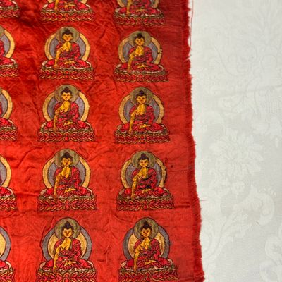 A Chinese red-ground brocade panel with seated Buddhas — photo 11