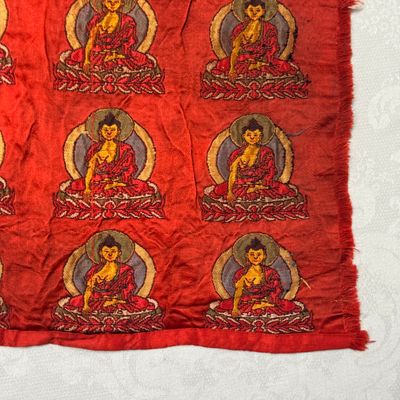 A Chinese red-ground brocade panel with seated Buddhas — photo 12