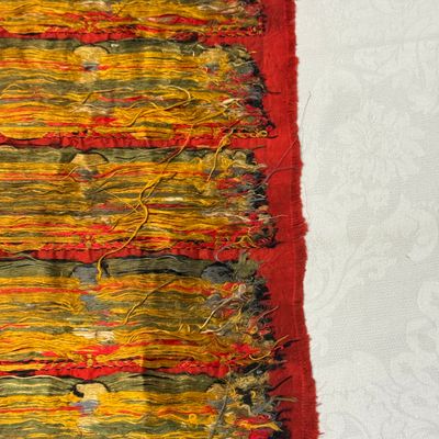 A Chinese red-ground brocade panel with seated Buddhas — photo 29