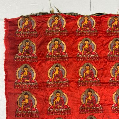 A Chinese red-ground brocade panel with seated Buddhas — photo 7
