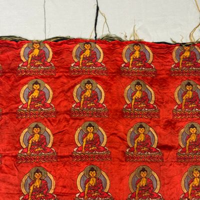A Chinese red-ground brocade panel with seated Buddhas — photo 8
