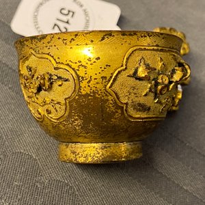 A Chinese relief-decorated gilt bronze cup, Ming — photo 14