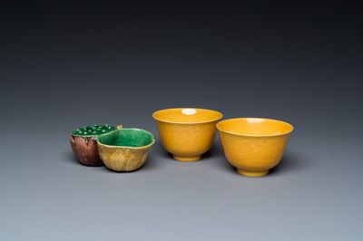 A Chinese sancai-glazed water dropper and a pair of yellow-glazed anhua 'dragon' bowls, Xianfeng mark, Kangxi and later
