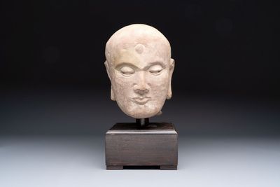A Chinese sandstone head of a Luohan, early Qing