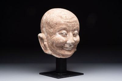 A Chinese sandstone head of a Luohan, Ming