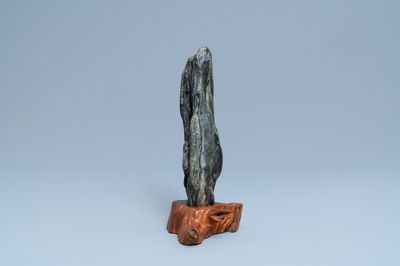 A Chinese scholar's dream stone on wooden stand, 19th C.