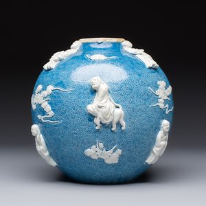 A Chinese sgraffiato blue-ground 'Luohan' vase with relief design, 19th C. — photo 1