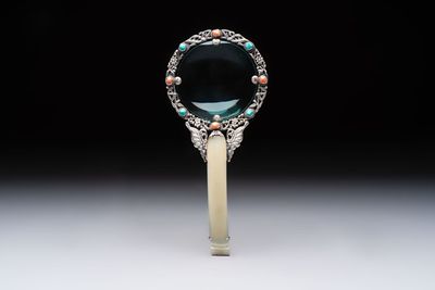 A Chinese silver-mounted magnifying glass with jade handle and precious stone inlays, 19th C.