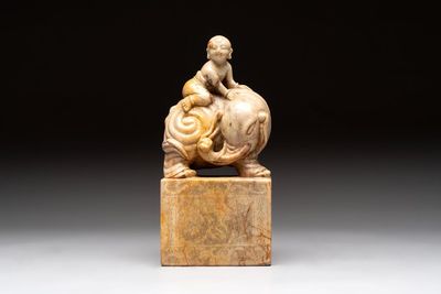 A Chinese soapstone carving of a boy riding an elephant, 20th C.