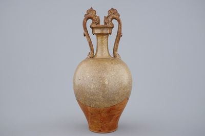 A Chinese stoneware amphora vase with dragon handles, Tang dynasty, 7th C.